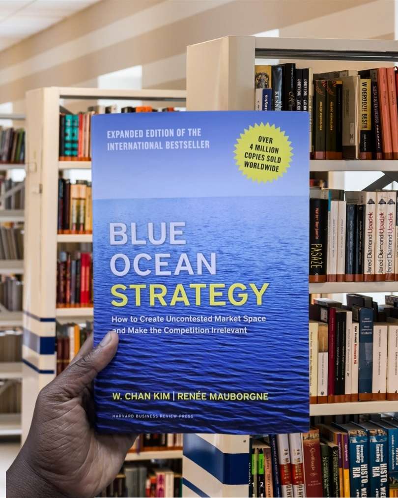 Cover of Blue Ocean Strategy by W. Chan Kim and Renée Mauborgne featuring a calm blue sea and a minimalist design.