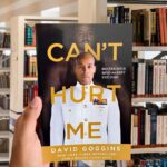 Book cover of Can't Hurt Me by David Goggins featuring a portrait of the author in a white military uniform.