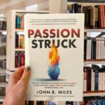 Cover of “Passion Struck” by John R. Miles, featuring a bold red and black design with the title in large typography.