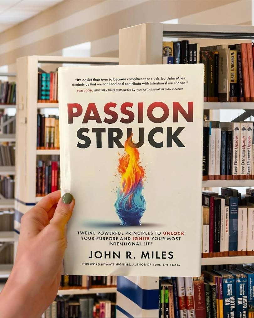 Cover of “Passion Struck” by John R. Miles, featuring a bold red and black design with the title in large typography.