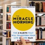 Cover of "The Miracle Morning" by Hal Elrod, featuring a sunrise and a silhouette of a person raising their arms.