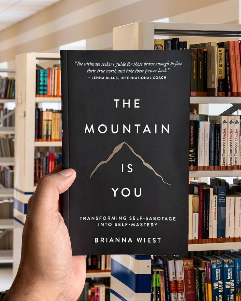 Cover of The Mountain Is You by Brianna Wiest, featuring a minimalist design with mountain imagery and a calm, neutral color palette.