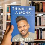 Cover of Think Like a Monk by Jay Shetty, featuring the author smiling with a blue background and bold title text.
