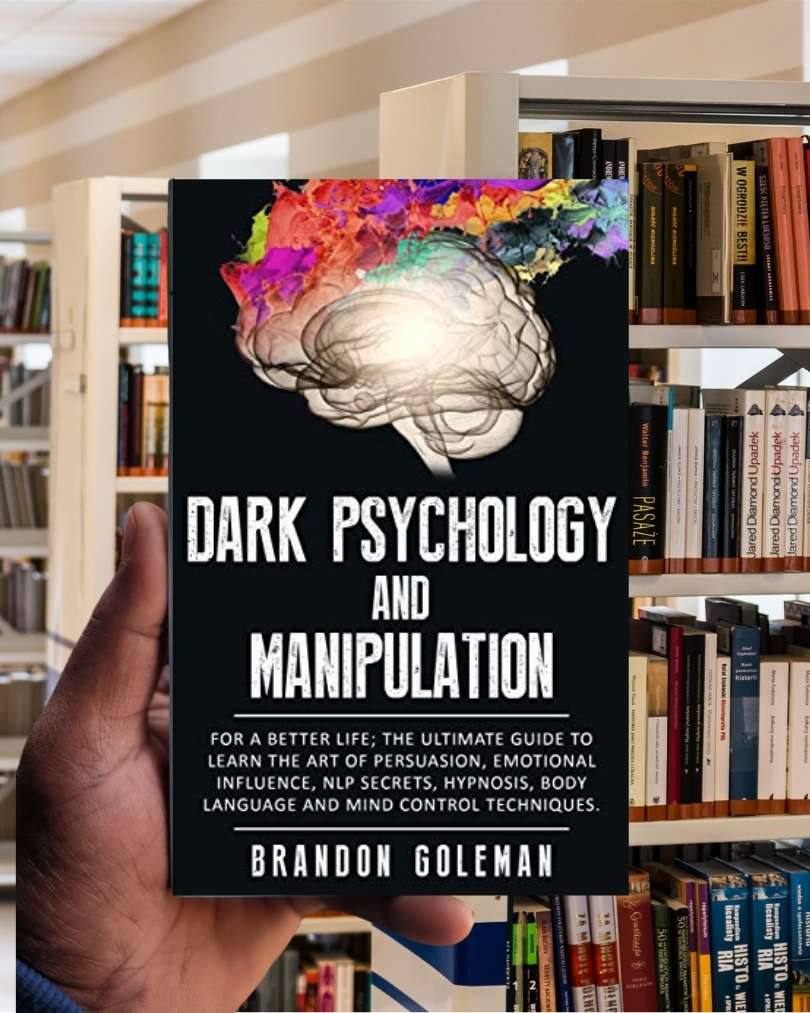 Book cover of “Dark Psychology & Manipulation” featuring a shadowed human silhouette with a web of strings connected to puppet hands.