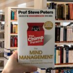 Cover of 'The Chimp Paradox' by Dr. Steve Peters featuring a red background, bold white text, and a cartoon chimp illustration.