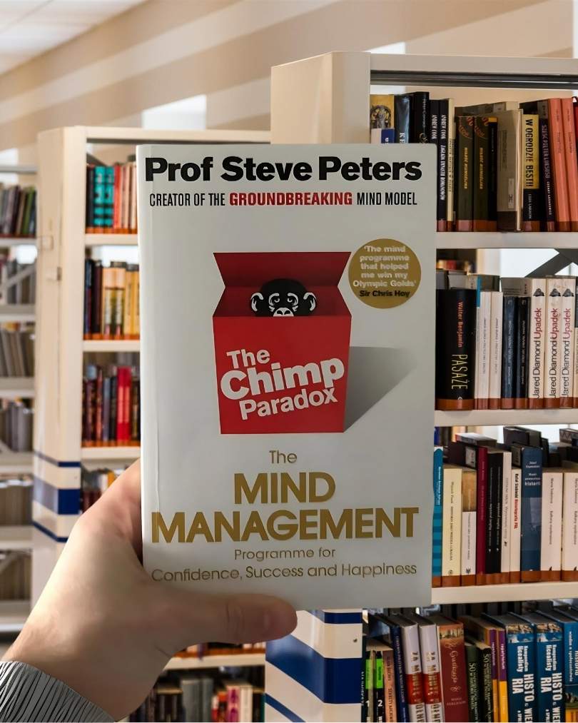 Cover of 'The Chimp Paradox' by Dr. Steve Peters featuring a red background, bold white text, and a cartoon chimp illustration.