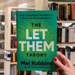 Cover of "The Let Them Theory" by Mel Robbins, featuring a clean, modern design with bold, empowering typography.