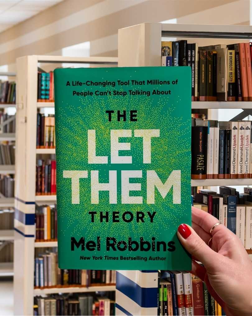 Cover of "The Let Them Theory" by Mel Robbins, featuring a clean, modern design with bold, empowering typography.